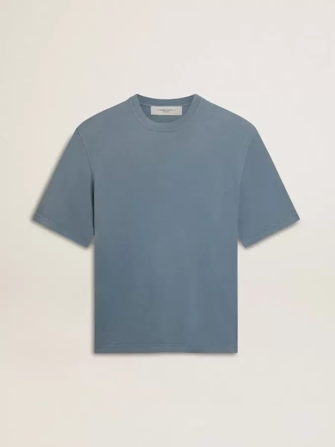 Unisex-T-shirt i bomull i babyblått med omvänd tryck på baksidan Unisex-T-shirt i bomull i babyblått med omvänd tryck på baksidan