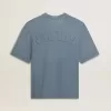 Unisex-T-shirt i bomull i babyblått med omvänd tryck på baksidan Unisex-T-shirt i bomull i babyblått med omvänd tryck på baksidan