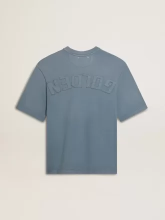 Unisex-T-shirt i bomull i babyblått med omvänd tryck på baksidan