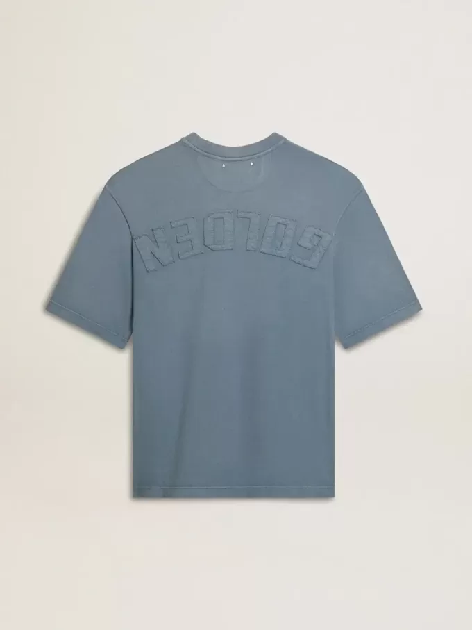 Unisex-T-shirt i bomull i babyblått med omvänd tryck på baksidan Unisex-T-shirt i bomull i babyblått med omvänd tryck på baksidan