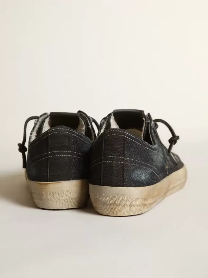 V-Star i midnattsblå denim med svart läderstjärna och tå