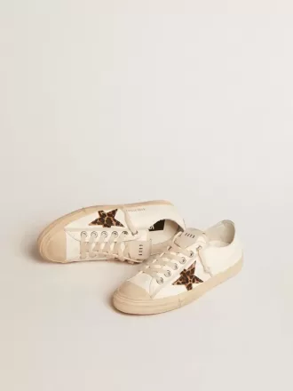 V-Star LTD i nappa med ponnyhudstjärna och silverfärgad hälflik