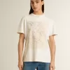 Vit dam-T-shirt med blommönster Vit dam-T-shirt med blommönster