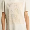 Vit dam-T-shirt med blommönster Vit dam-T-shirt med blommönster
