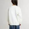 Vit sweatshirt för flickor med mångfärgad Golden-text på framsidan Vit sweatshirt för flickor med mångfärgad Golden-text på framsidan