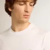 Vit T-shirt för herr med silverglittrande stjärna på framsidan Vit T-shirt för herr med silverglittrande stjärna på framsidan