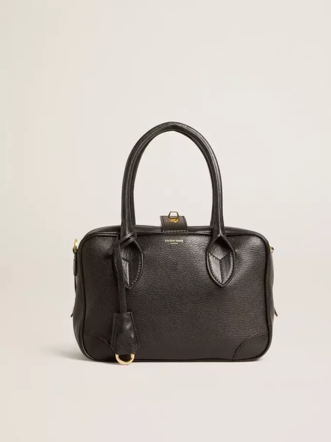 Vita Bag i svart fårskinn med gulddetaljer Vita Bag i svart fårskinn med gulddetaljer