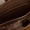 Vita Bag i svart slitet läder med gulddetaljer