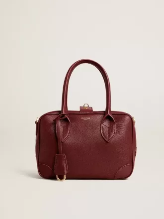 Vita Bag i vinrött läder med gulddetaljer