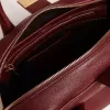 Vita Bag i vinrött läder med gulddetaljer Vita Bag i vinrött läder med gulddetaljer