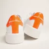 Vita Purestar-sneakers med fluorescerande orange hälflik Vita Purestar-sneakers med fluorescerande orange hälflik